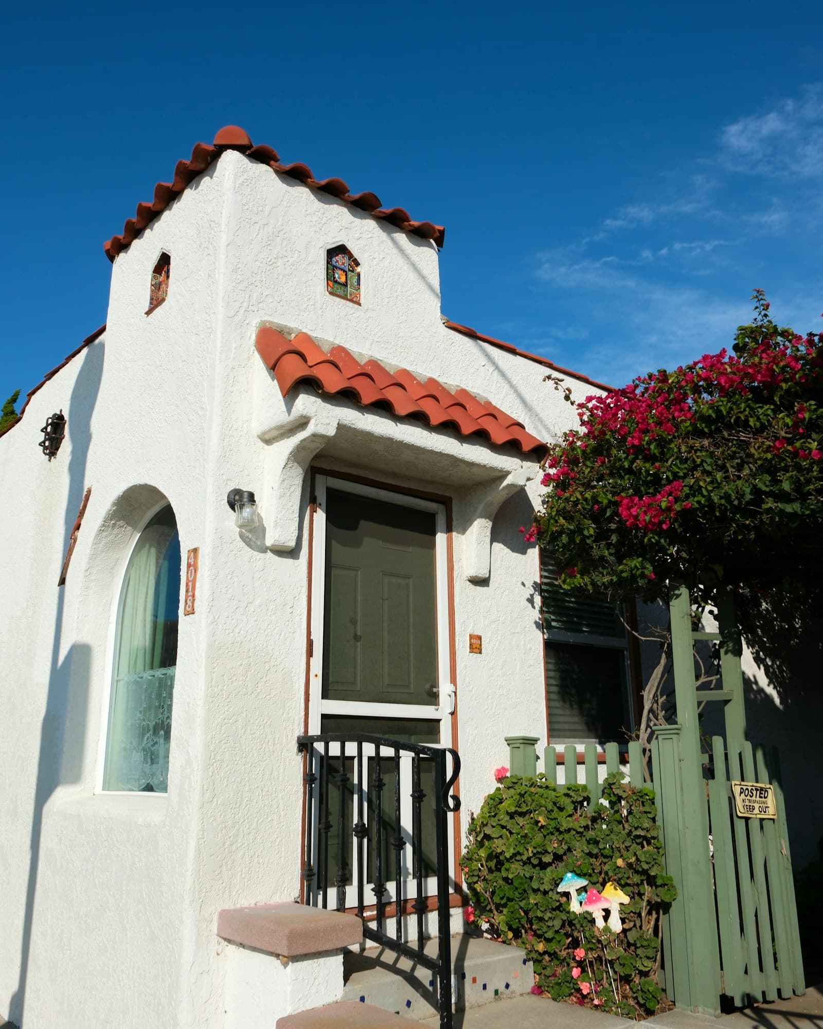 White stucco home with a red tile roof, the kind of exterior Krystal Kleen soft washes